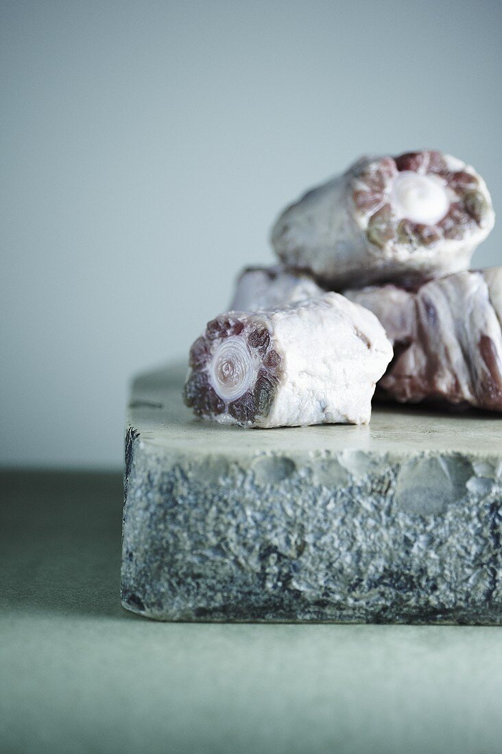 Raw Oxtail Pieces on Stone