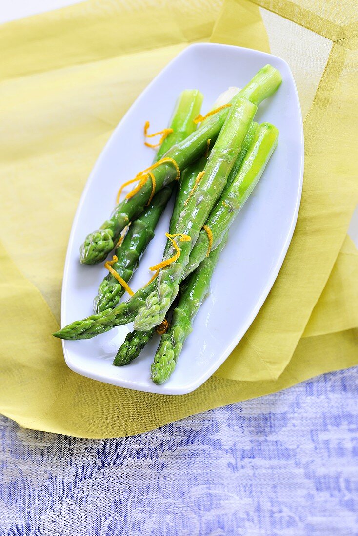 A green asparagus with orange zest