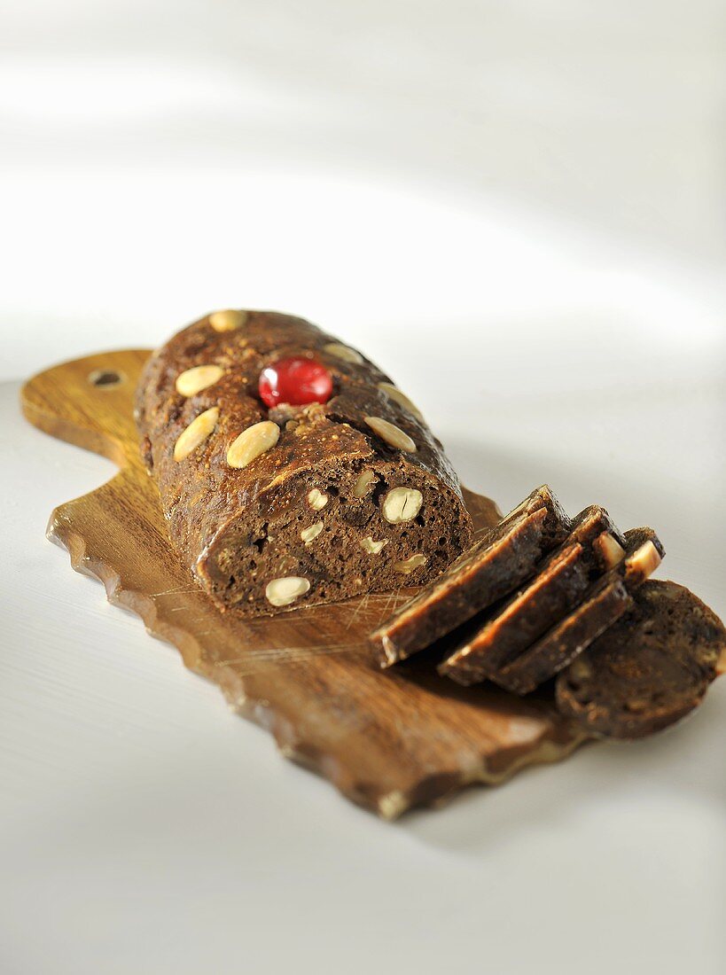 Fruit bread with almonds, sliced