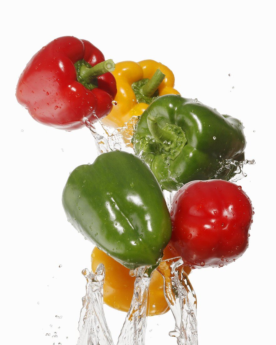 Colourful peppers being washed