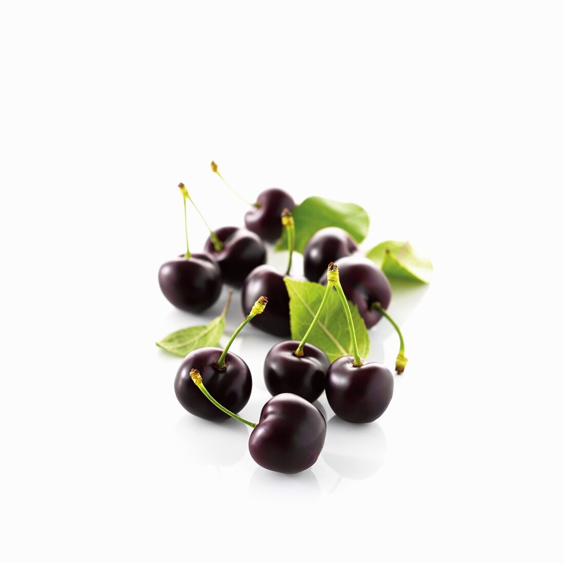 Black cherries with stem and leaves