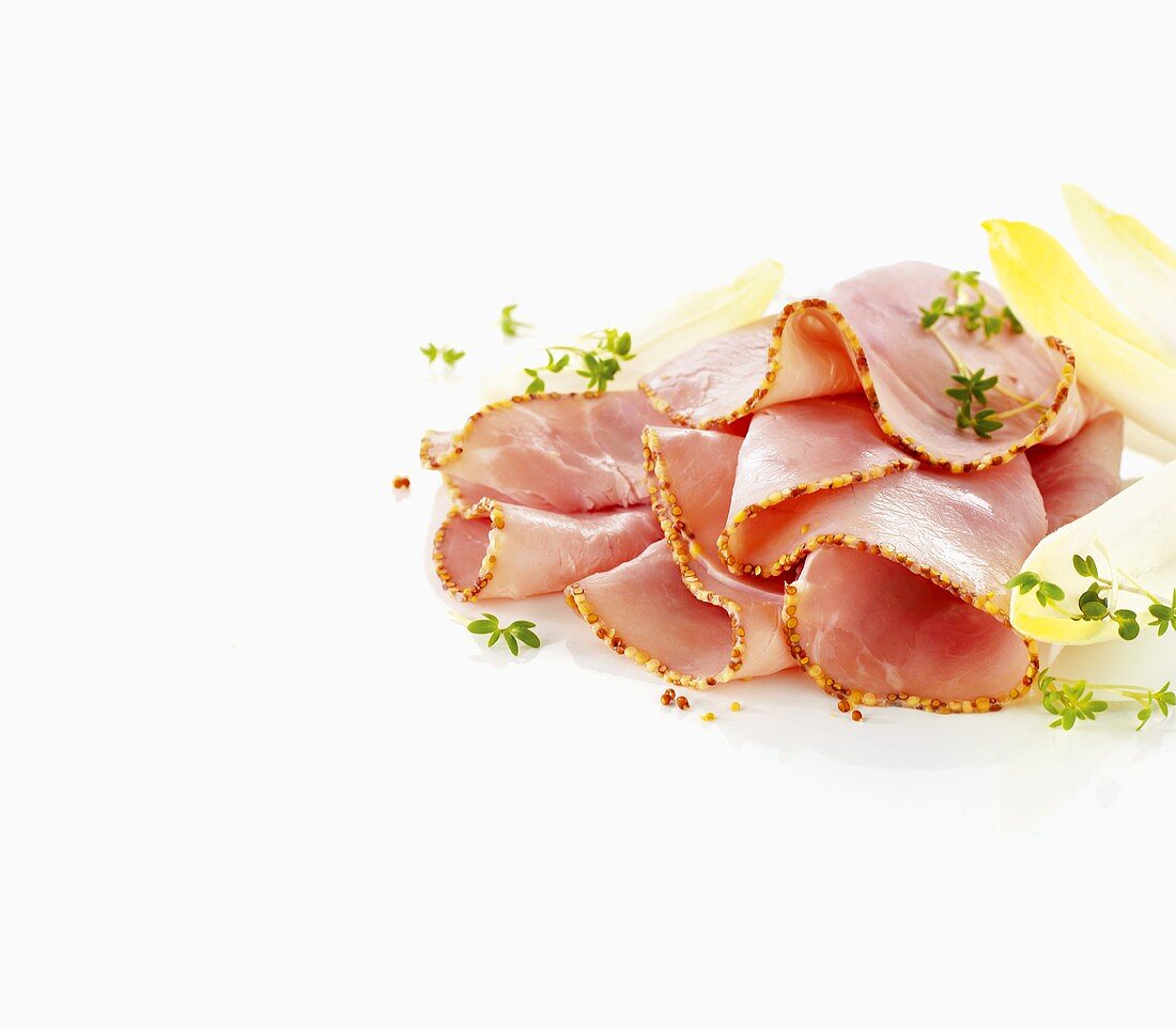 Boiled ham with a mustard crust, sliced