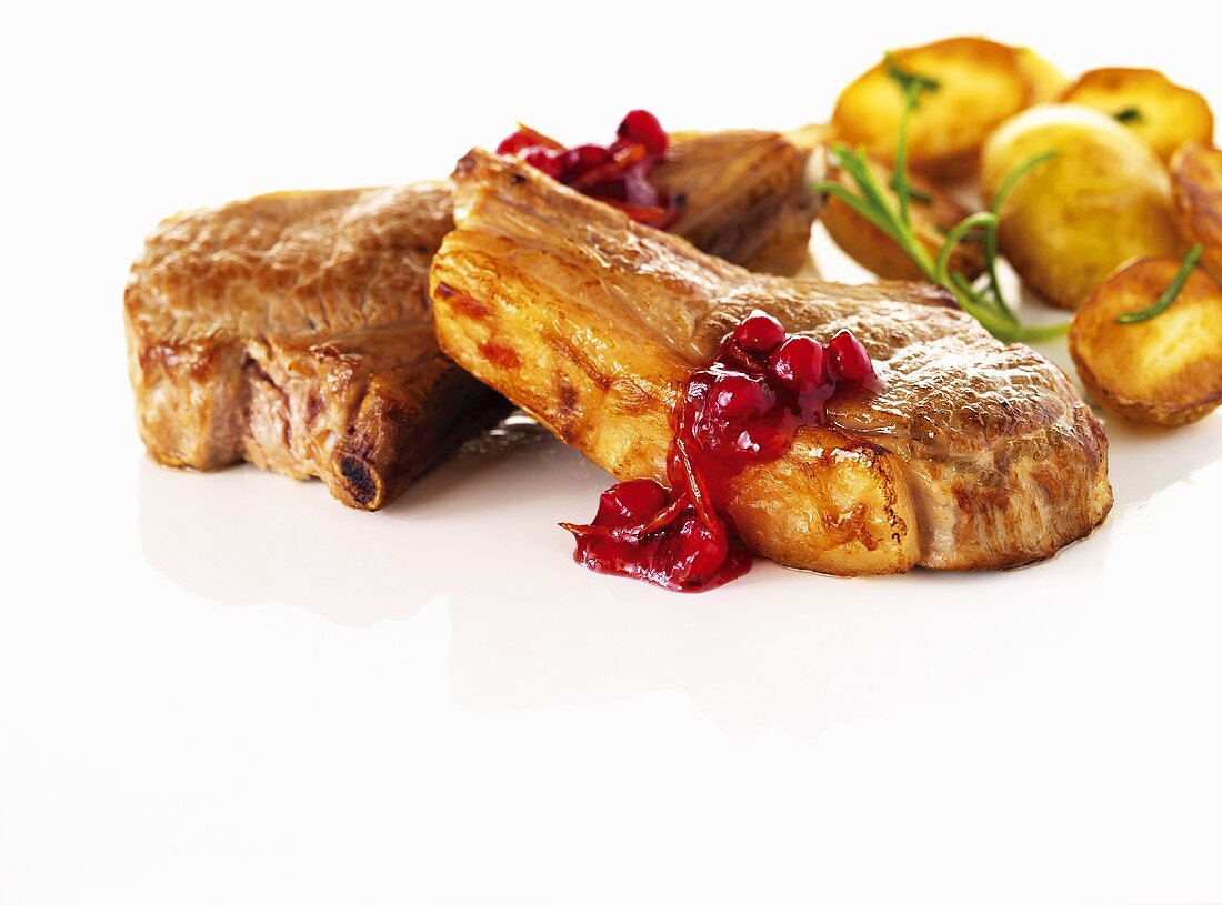 Lamb chops with cranberries and roast potatoes