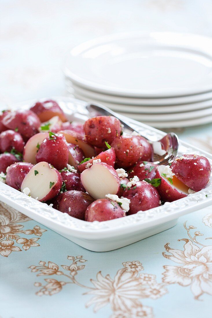 Boiled Red Bliss Potatoes with Feta Cheese and Parsley in a Serving Dish