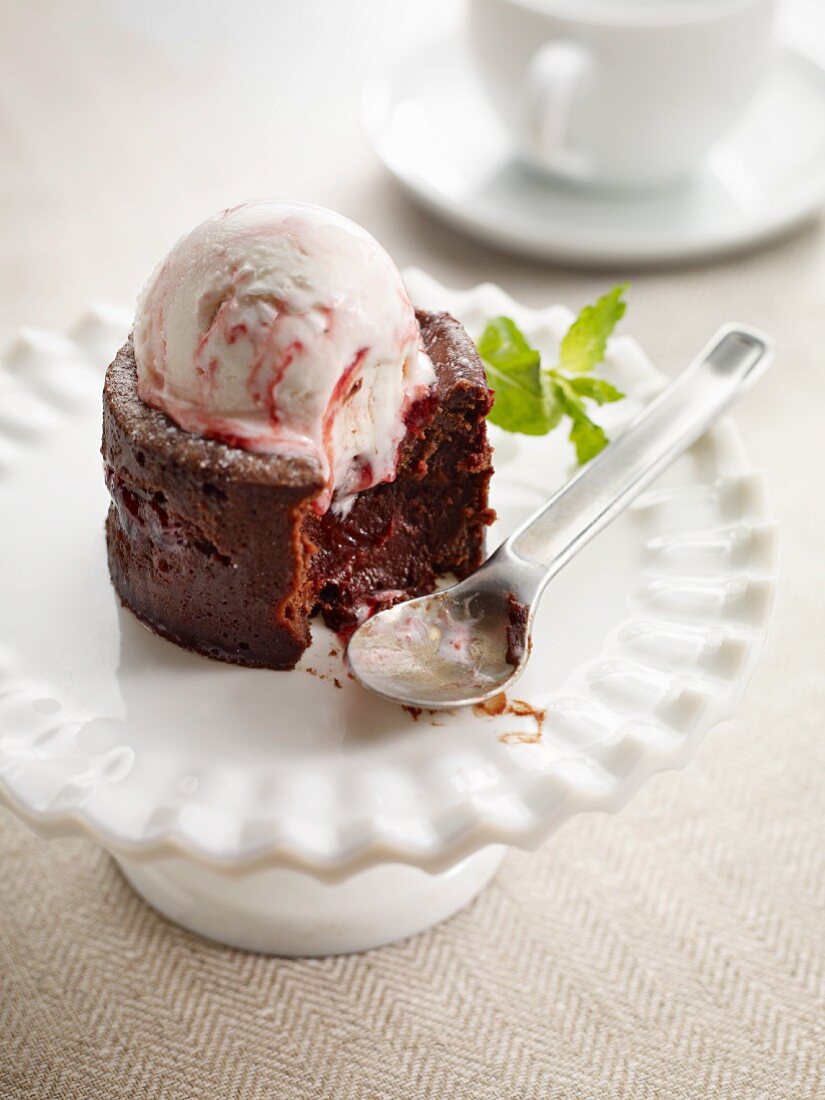 Chocolate cake with raspberry ice cream with a bite take out