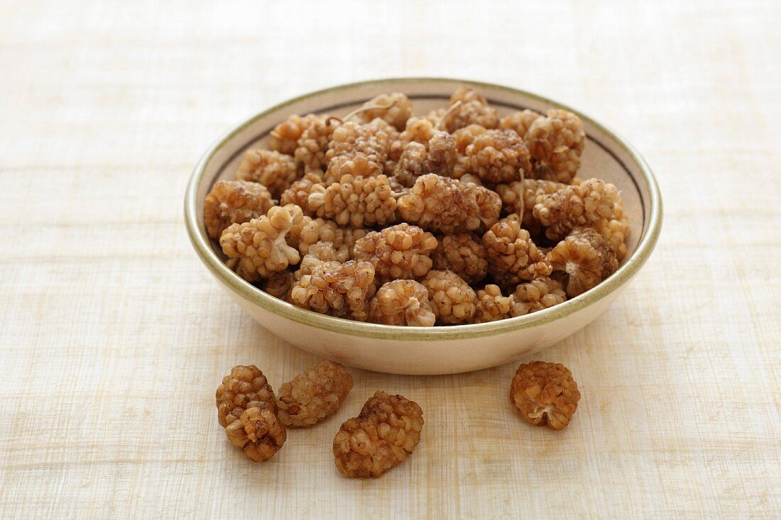 A bowl of dried white mulberries