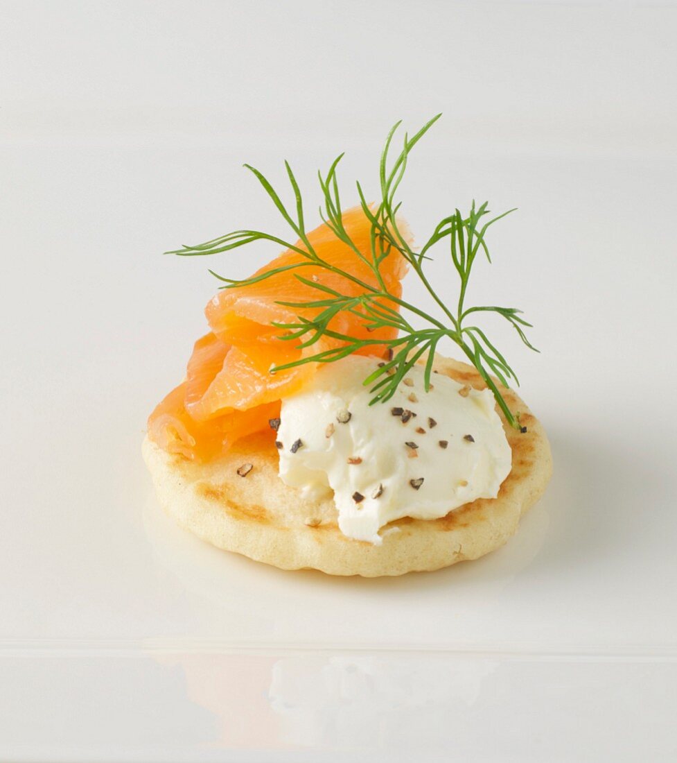 A blini with cream cheese and smoked salmon