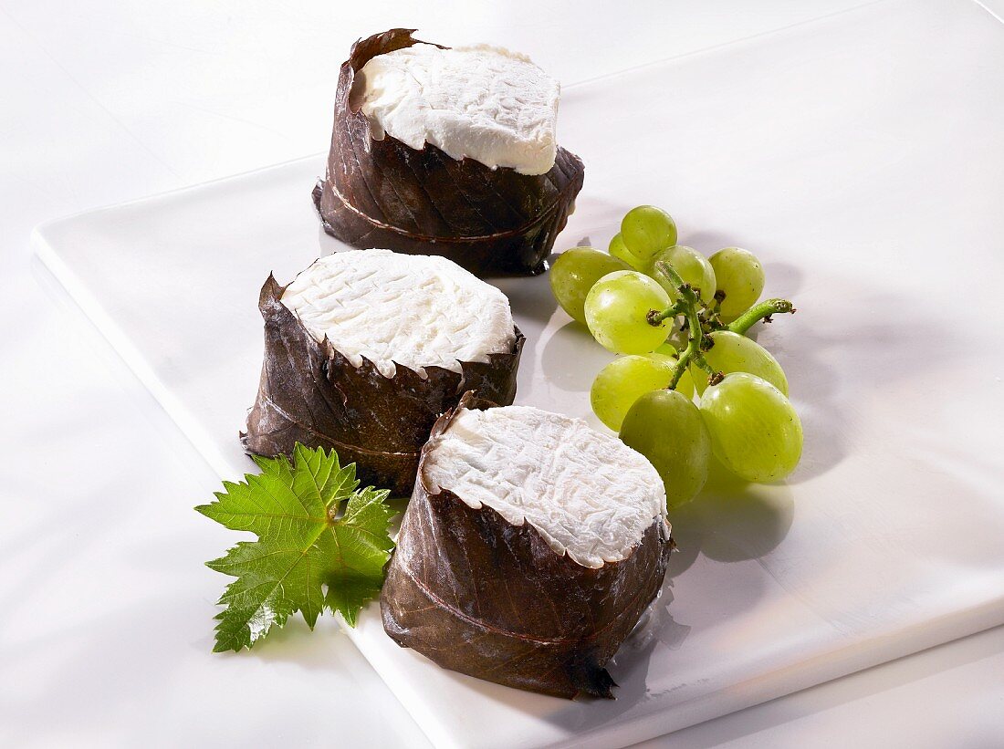 Chabisfeuille (goat's cream cheese wrapped in chestnut leaves) and grapes