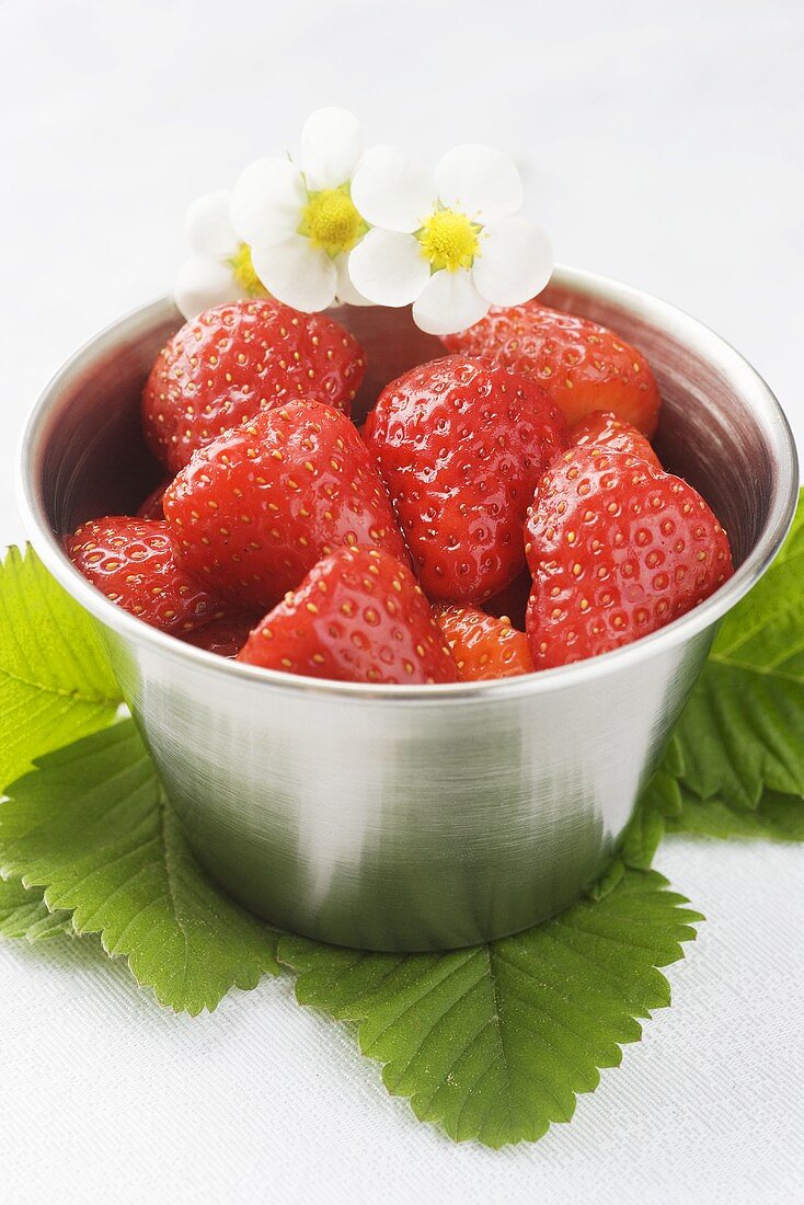 Fresh strawberries in a metal bowl