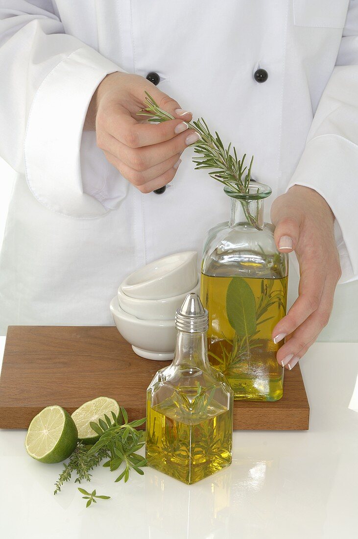 Female chef making herb oil