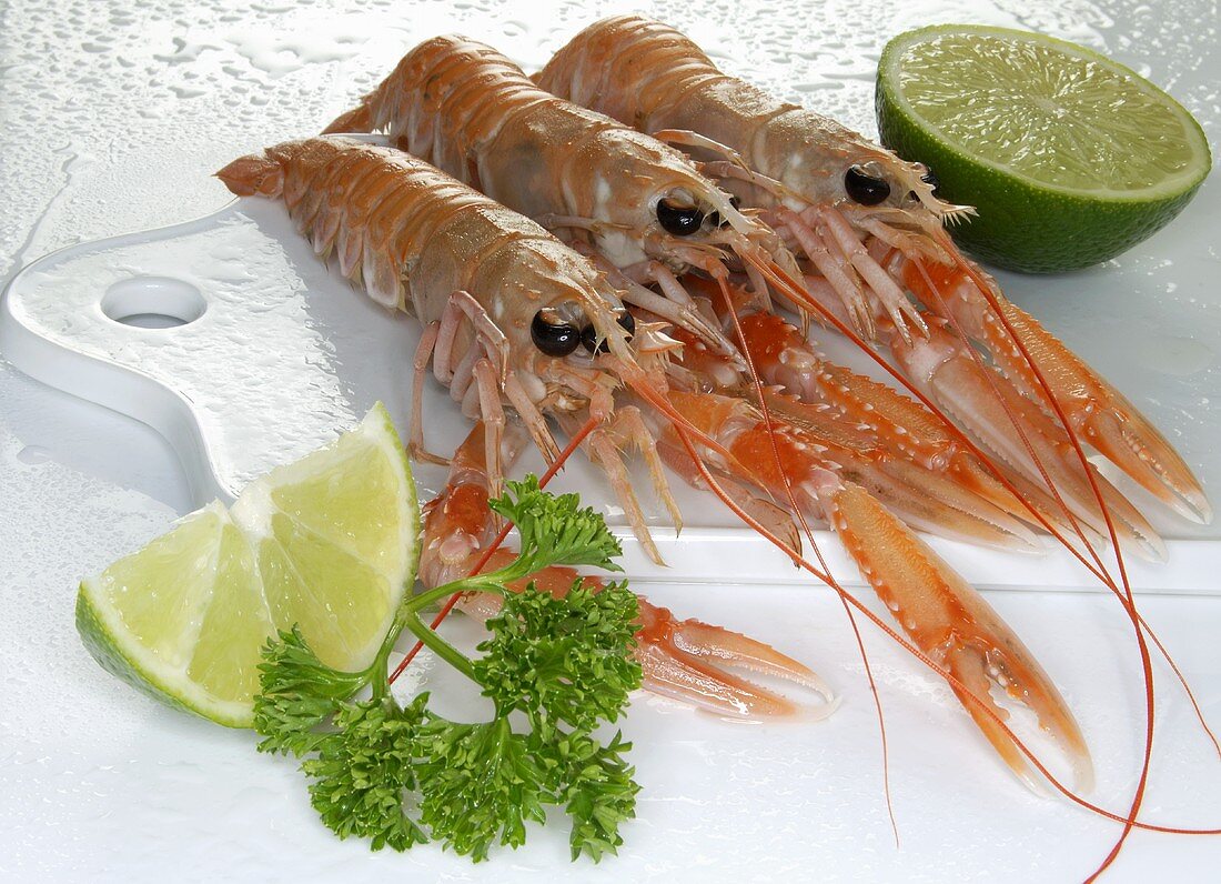Cooked prawns, pieces of lime and parsley
