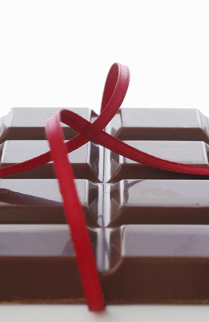 Chocolate bar with red ribbon