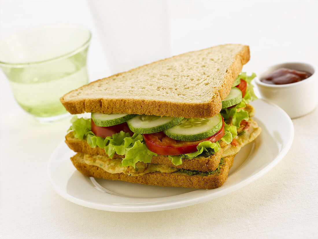 Club sandwich with chicken breast, cucumber and tomato