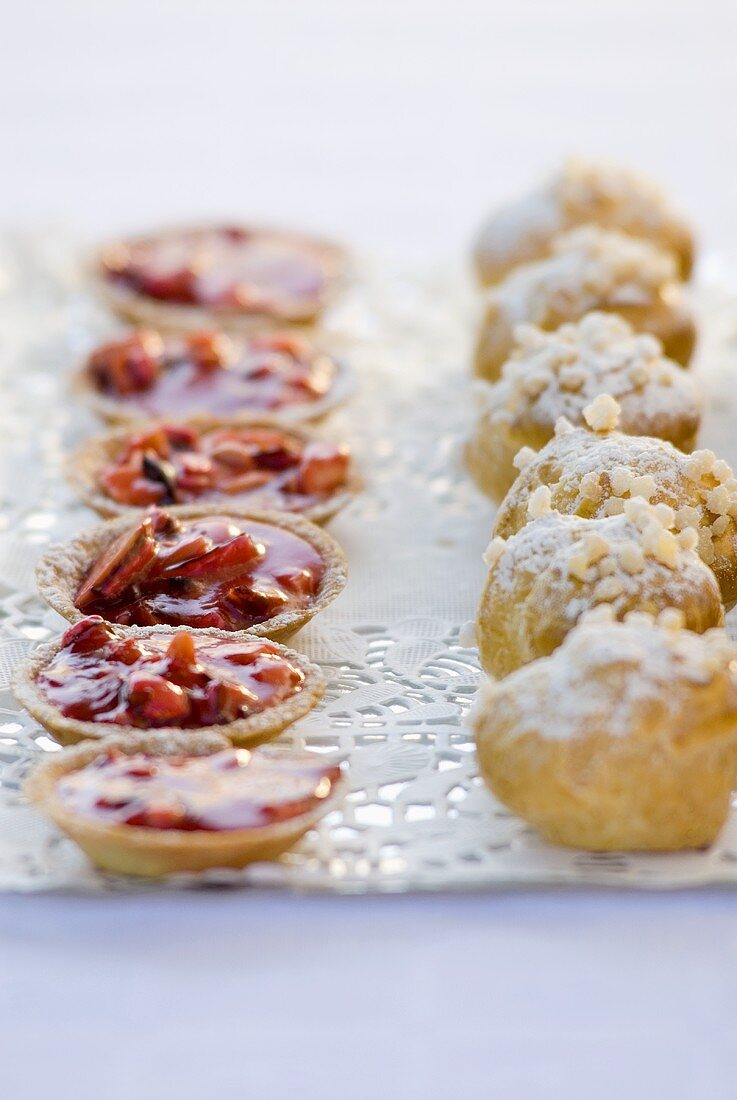 Profiteroles and tartlets on a tray