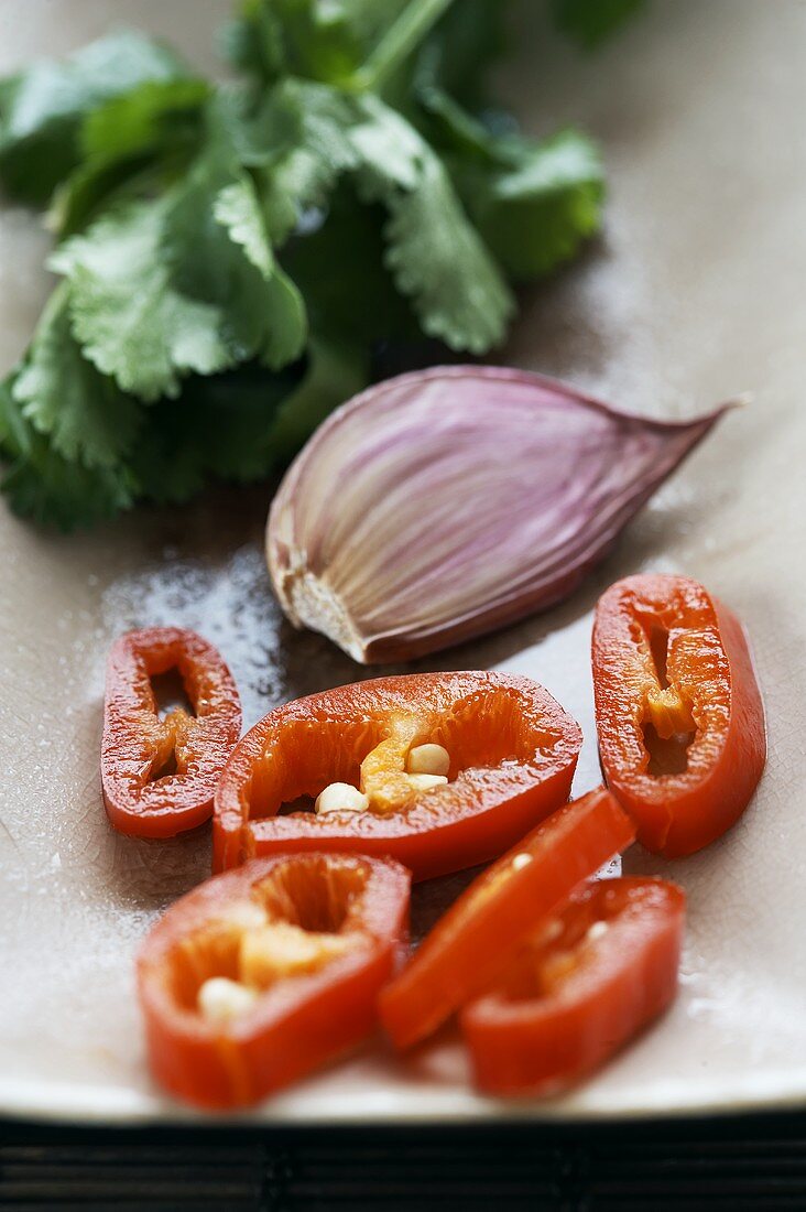 Coriander, a garlic clove and sliced chilli