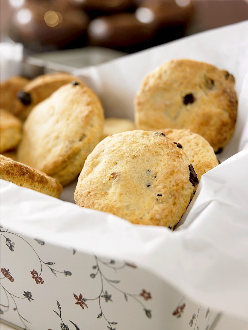 Raisin scones in a biscuit tin