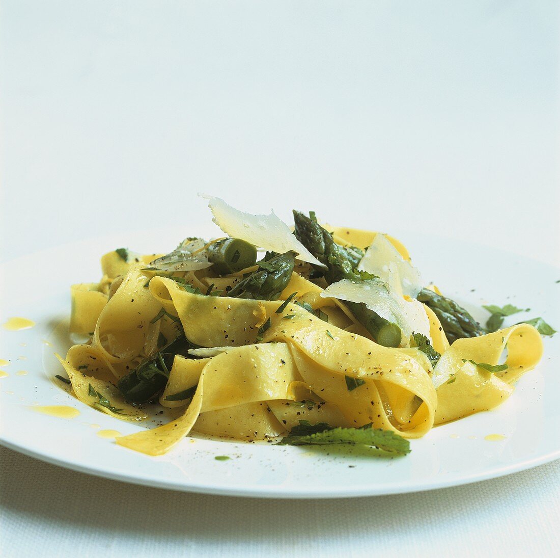 Ribbon pasta with green asparagus, lemon, herbs and Parmesan
