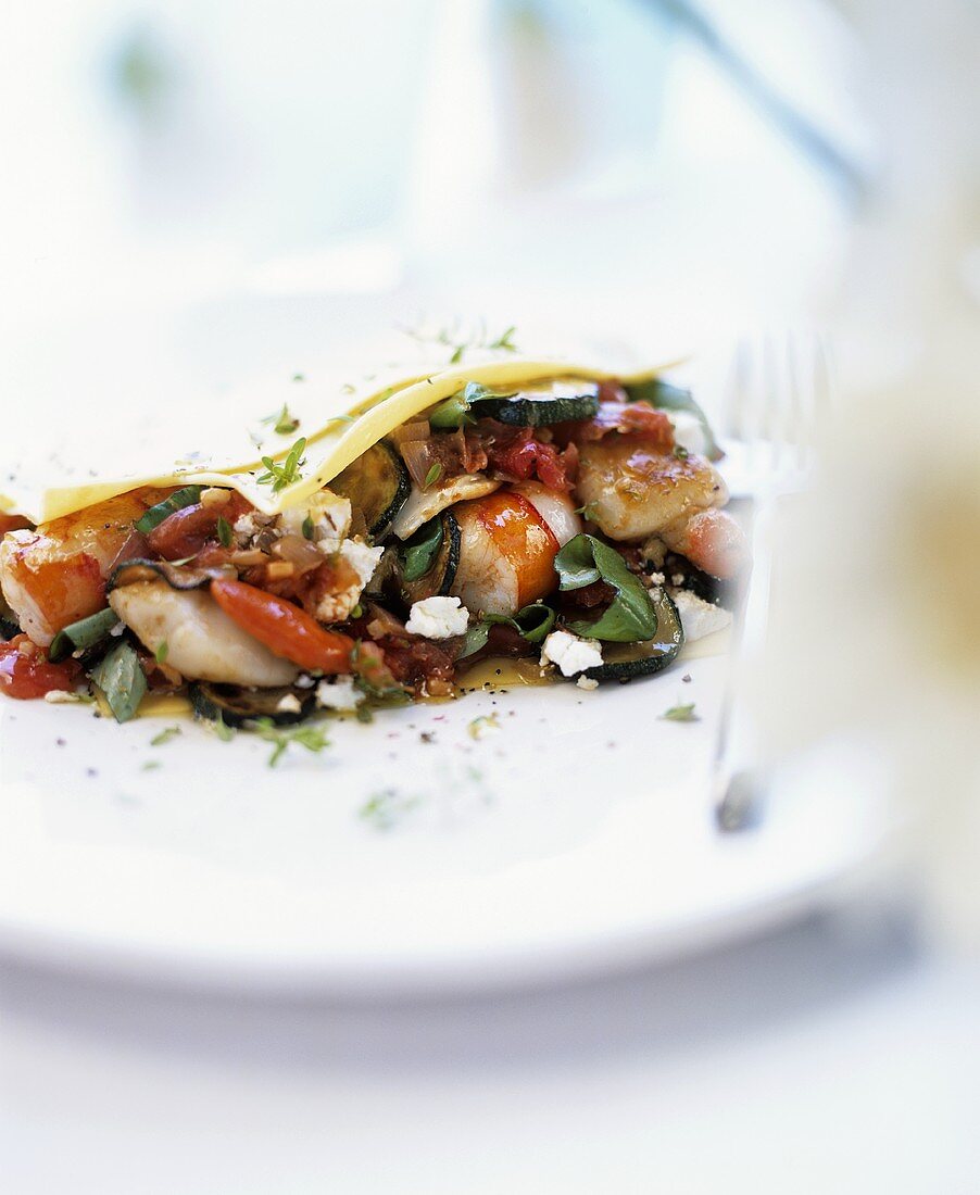 Pasta filled with seafood, vegetables and feta