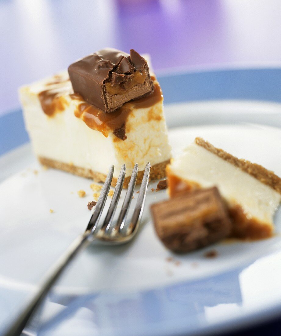 A piece of caramel cheesecake with chocolate bar
