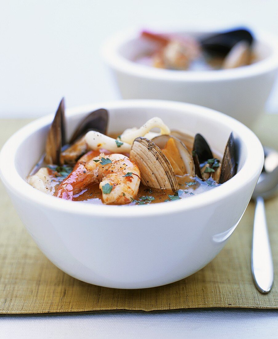 Two bowls of seafood soup