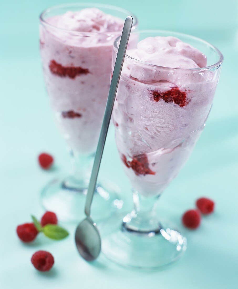 Raspberry ice cream in two sundae glasses