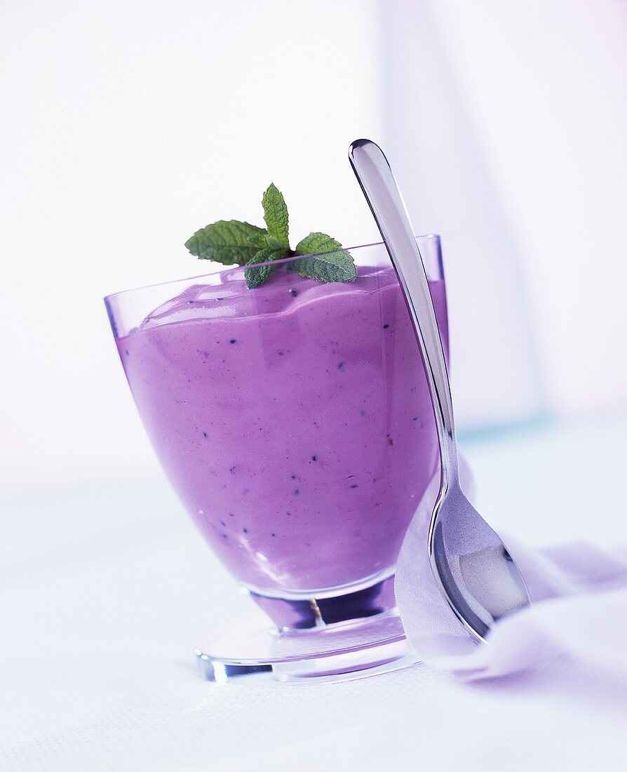 Berry yoghurt with mint in a glass