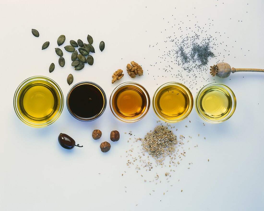 Various types of oil with the raw ingredients