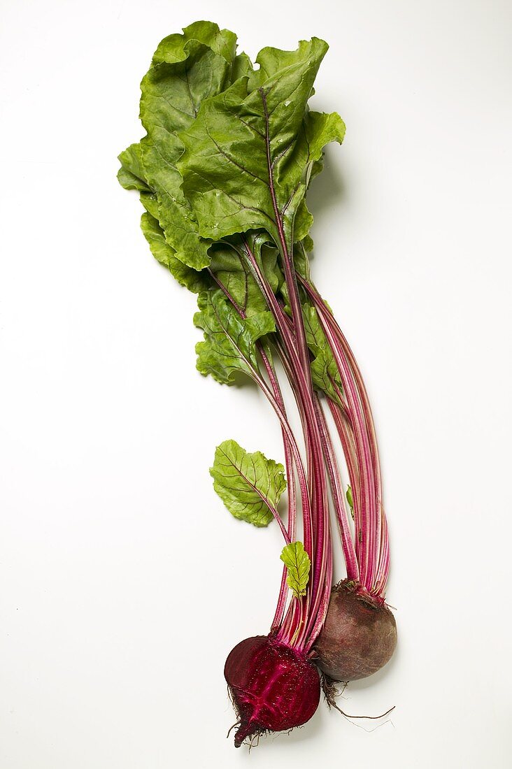 Beetroot with leaves, one halved