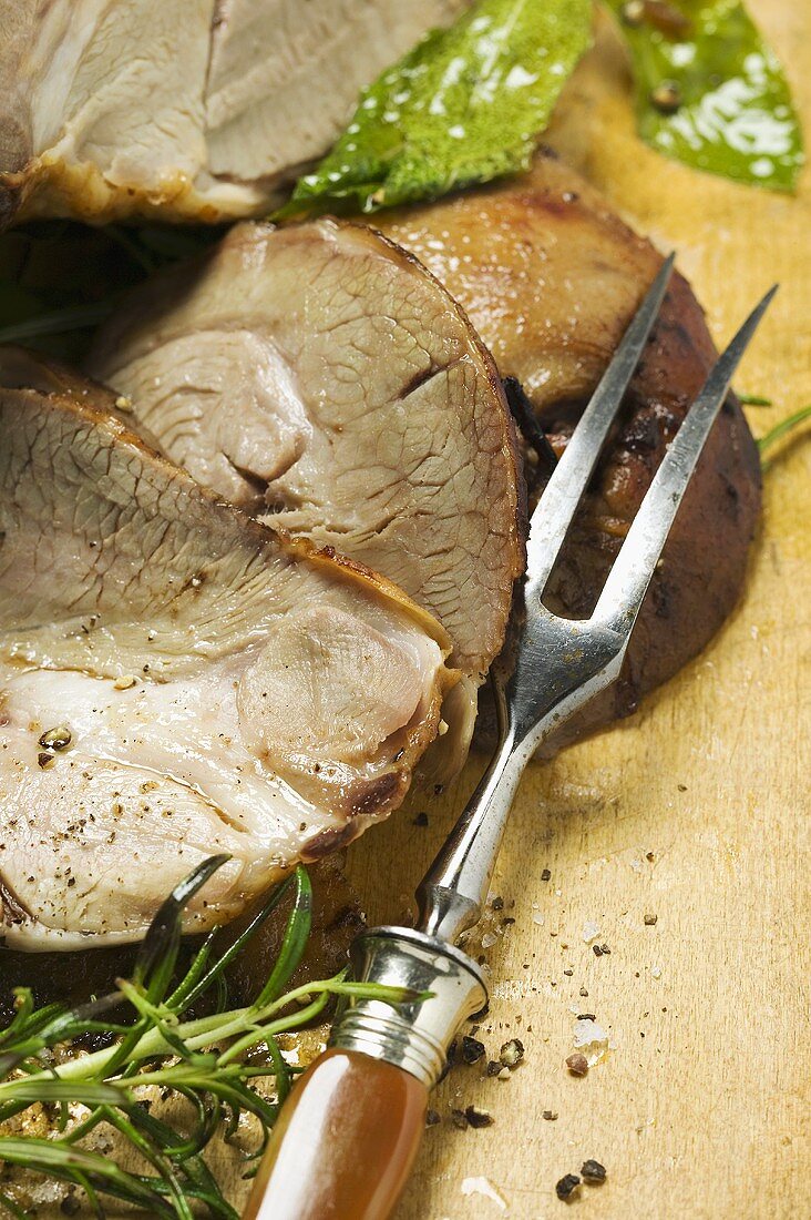 Roast leg of lamb, slices carved (close-up)