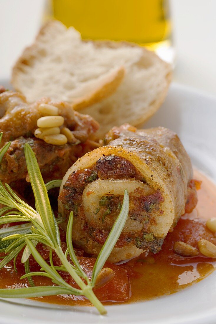 Belly pork rolls with tomato pesto and pine nuts