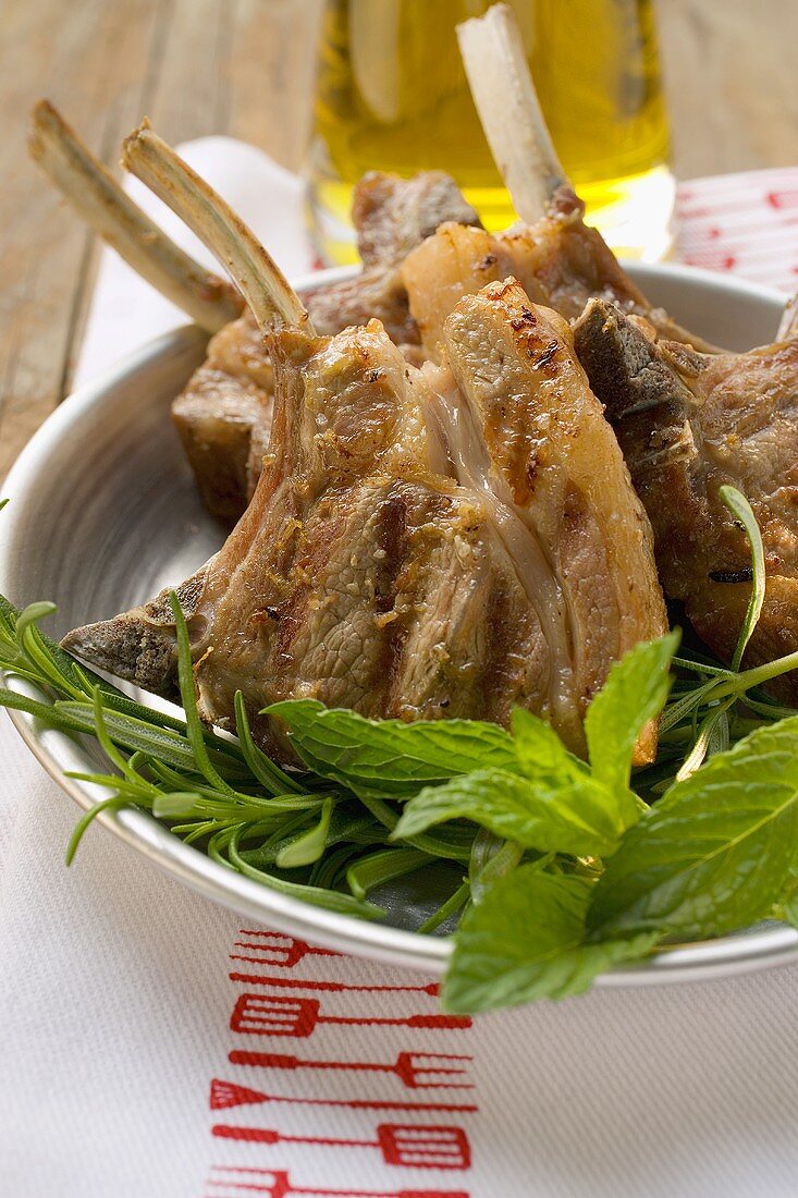 Grilled lamb cutlets, fresh herbs, olive oil