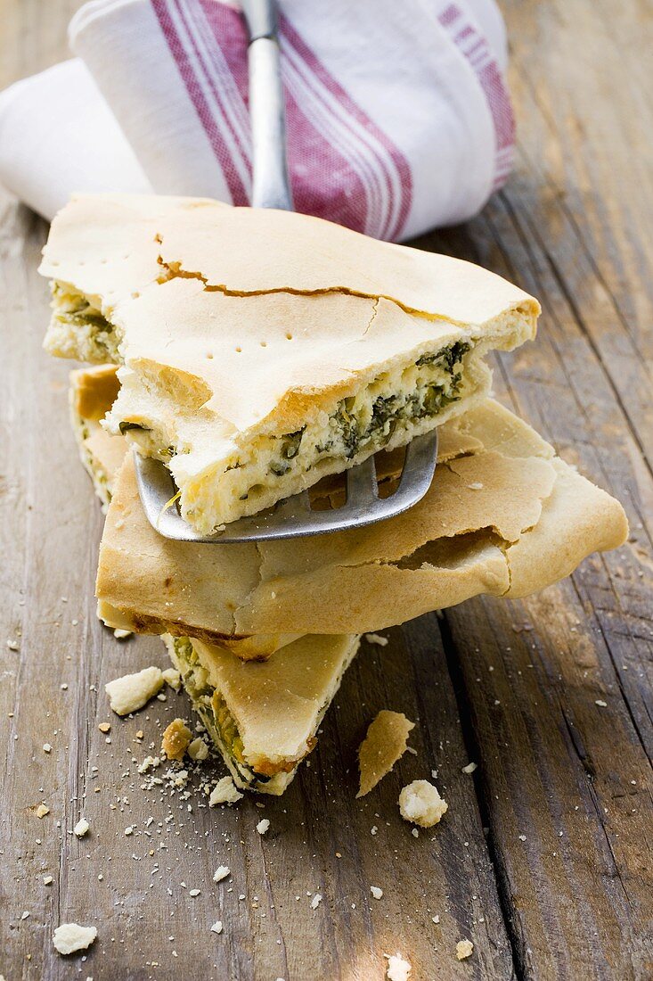 Spinach and ricotta pie (one piece on spatula)