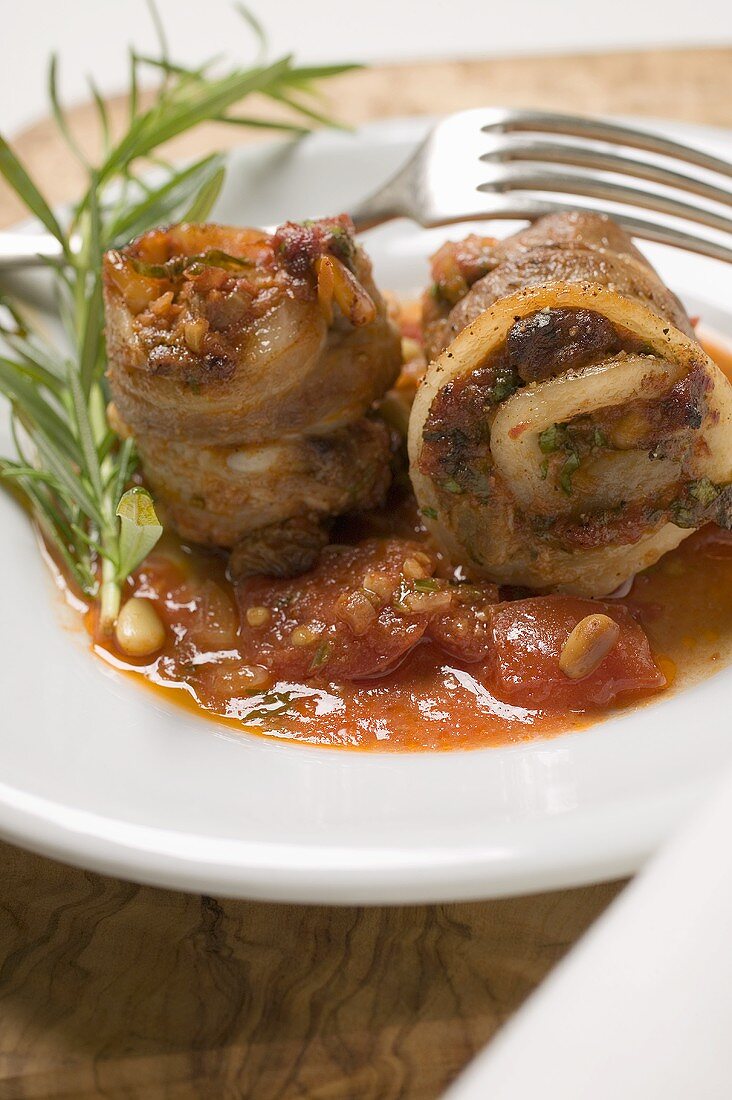 Belly pork rolls with tomato pesto and rosemary