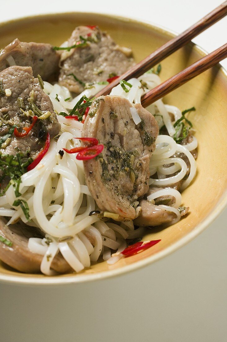 Rice noodles with pork fillet and chili peppers (Asia)