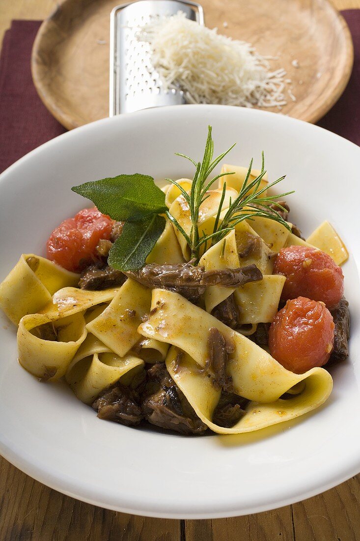 Ribbon pasta with braised oxtail, tomatoes and cheese