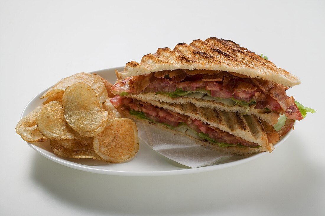 BLT sandwiches, toasted, with crisps