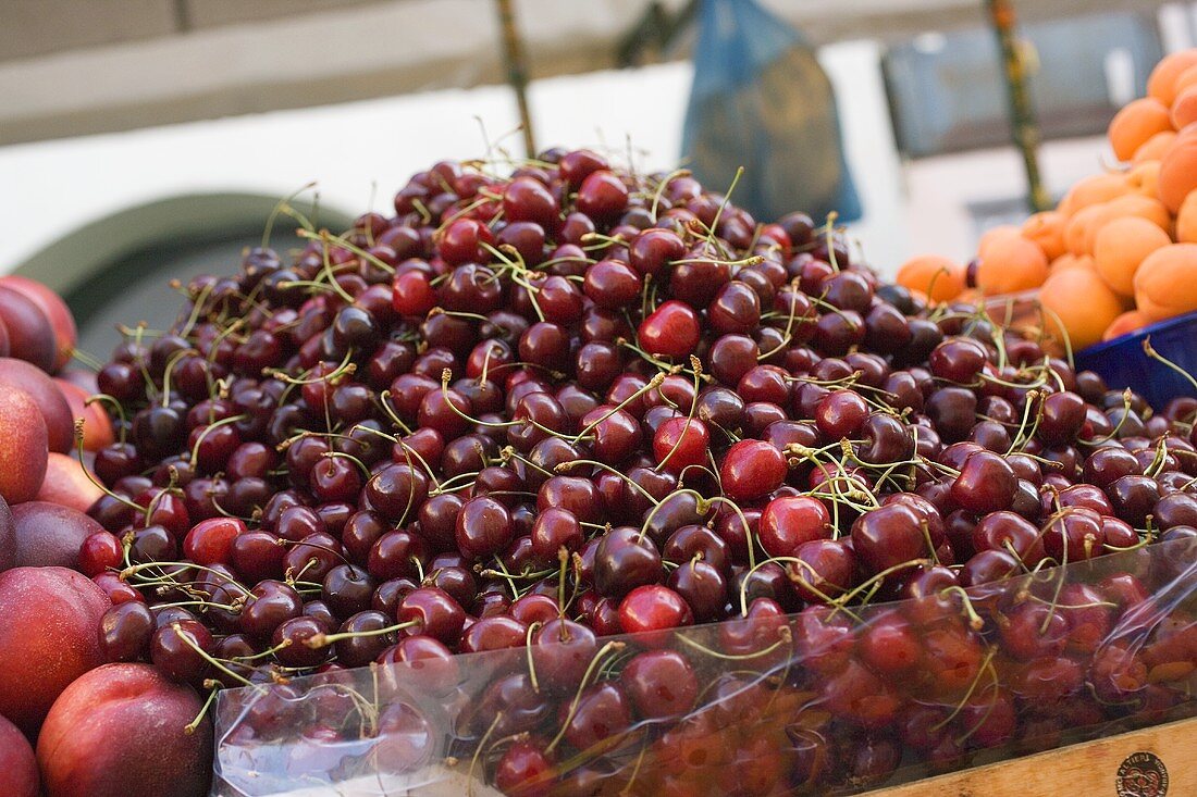 A heap of cherries at a market