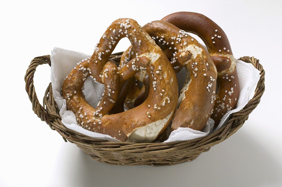 Three salted pretzels in bread basket