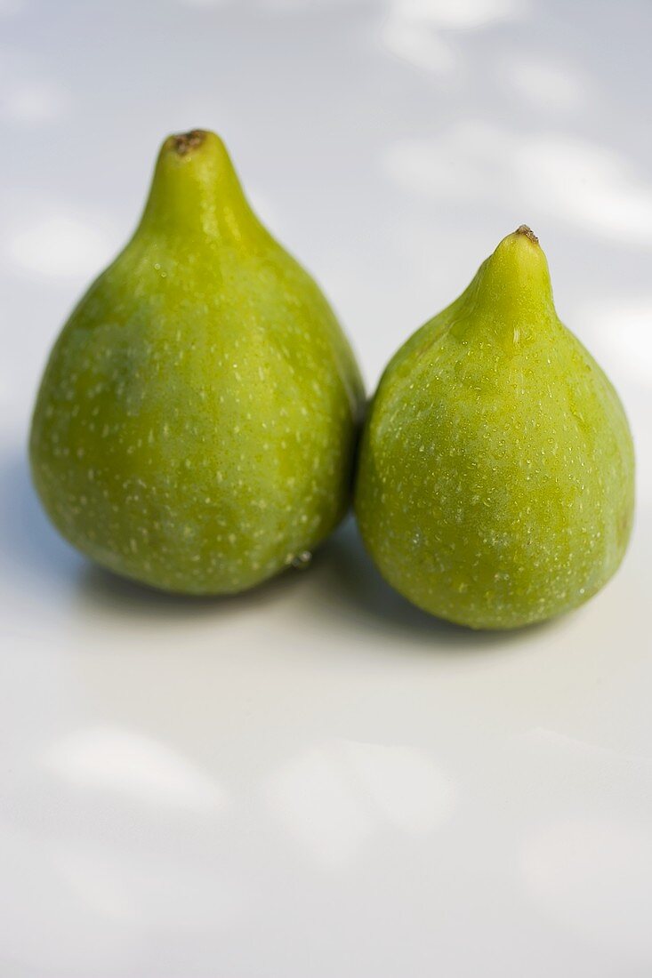 Two fresh green figs