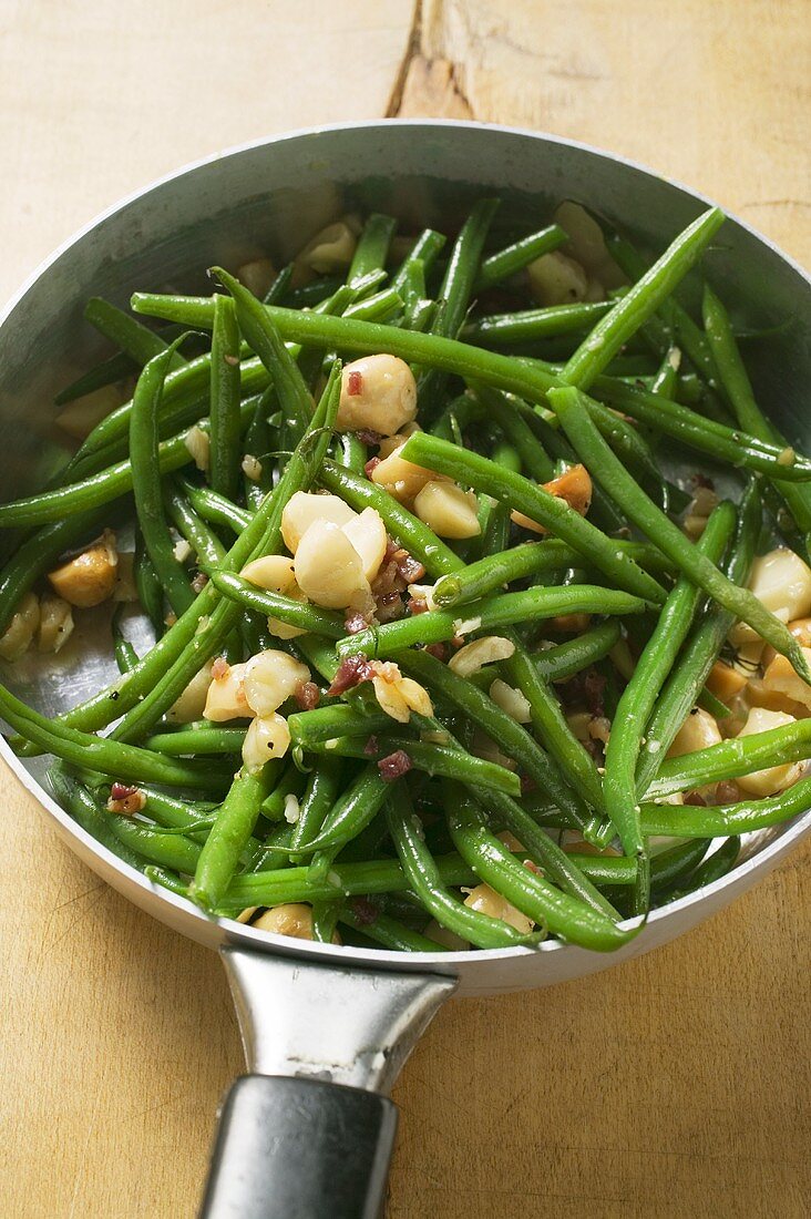 Fried green beans in frying pan