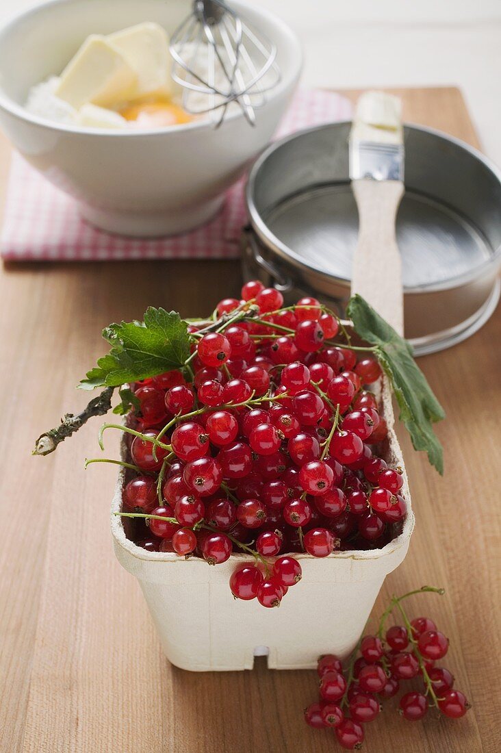 Redcurrants, baking ingredients and utensils