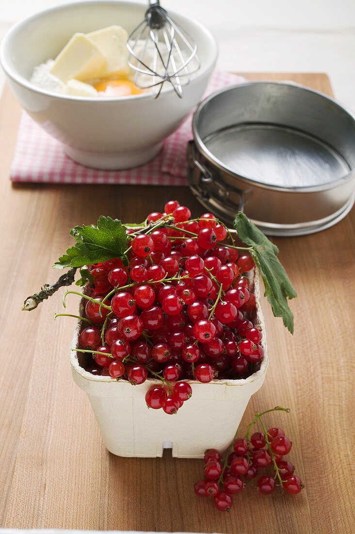 Redcurrants, baking ingredients and utensils