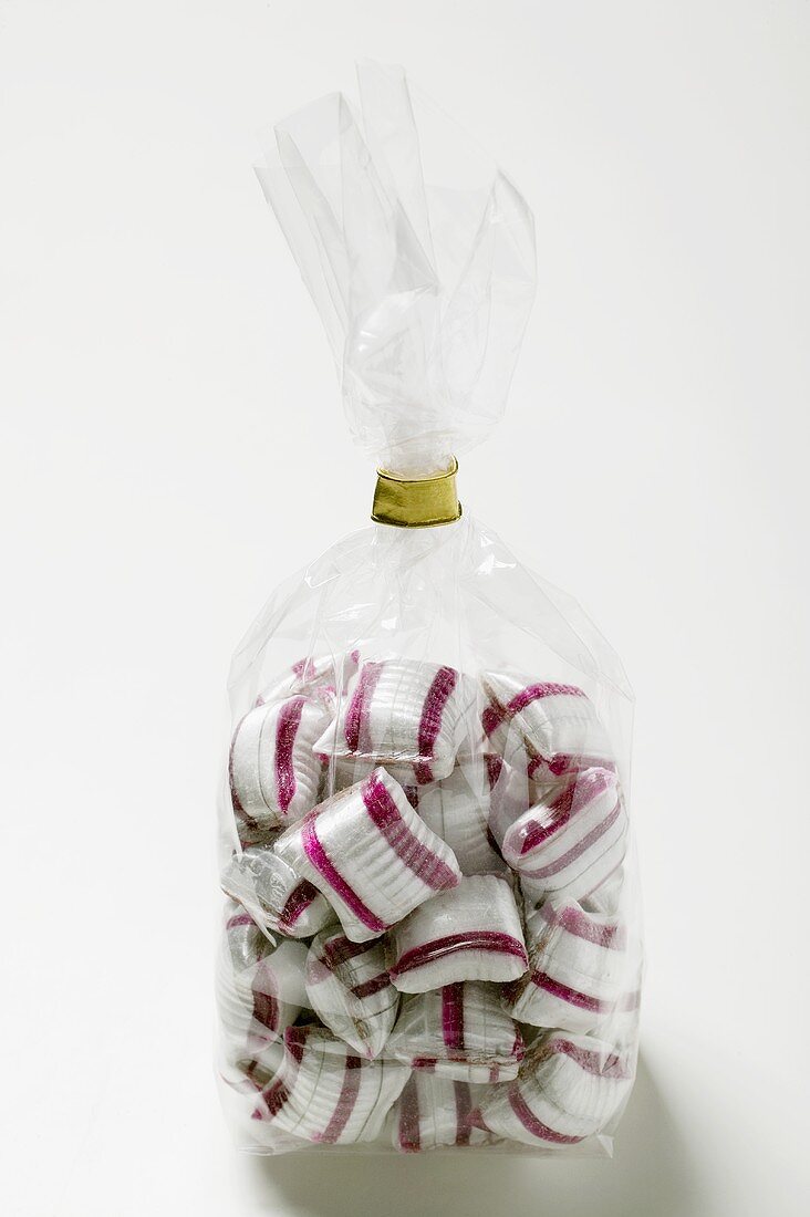 Cherry mint sweets in cellophane bag