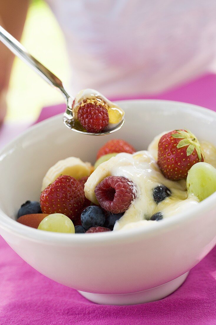 Fruit muesli with yoghurt and honey