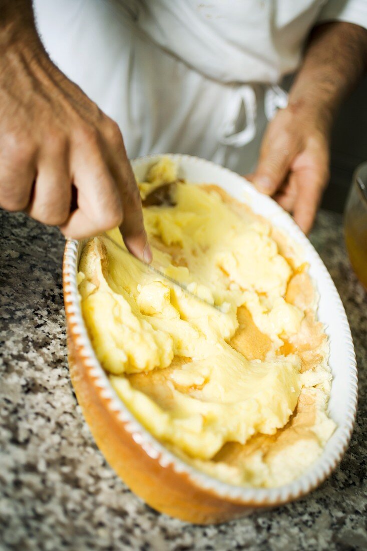 Spreading cream mixture on sponge