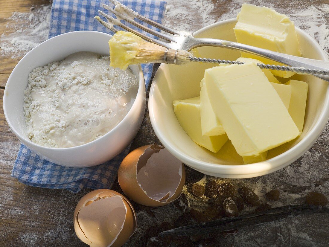 Baking ingredients (butter, yeast), pastry brush, fork