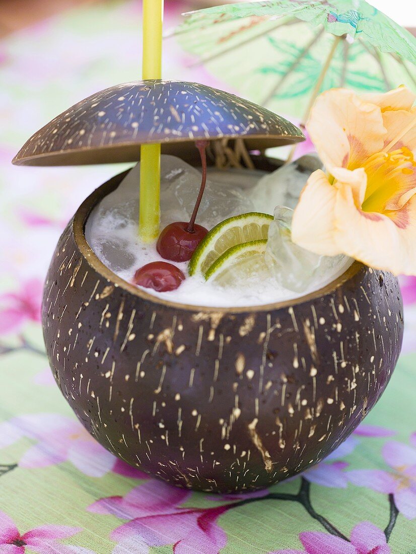 Pina Colada with cherries, lime and flower