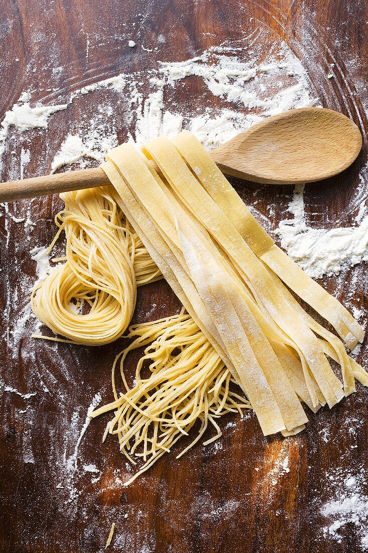 Home-made pasta with wooden spoon