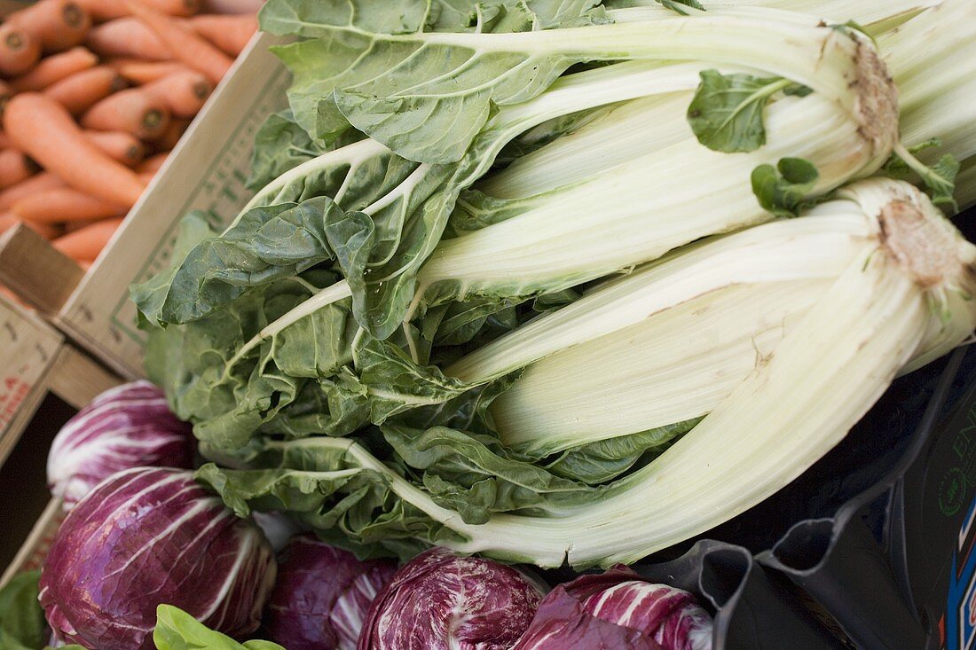 Fresh chard, radicchio and carrots at a market