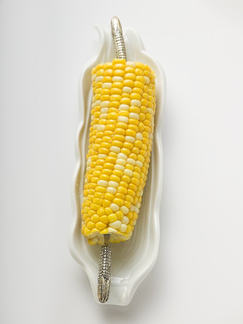 Corn cob in white dish